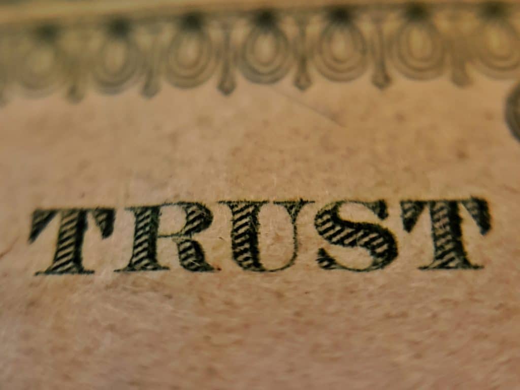 The word trust in antique lettering formal trust document close up trust and divorce