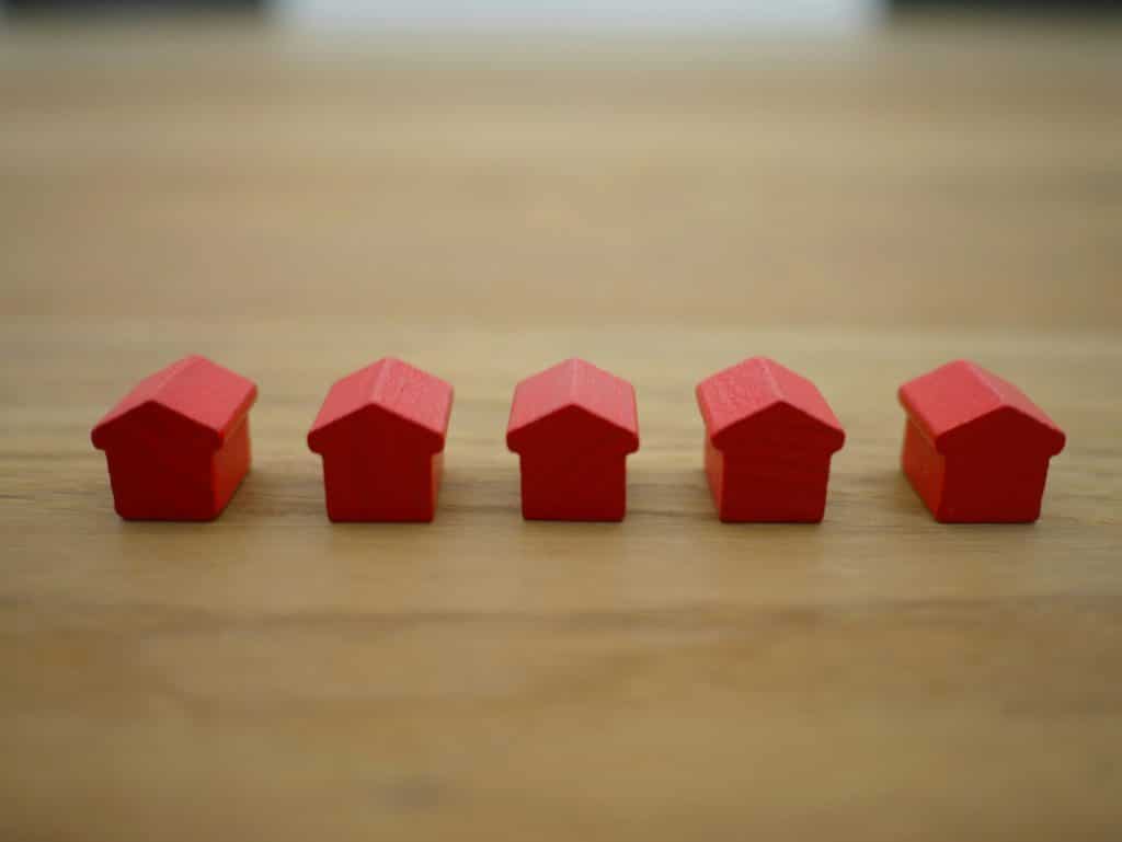 tierra mallorca jxi2ap8dtnc unsplash row of wooden houses o table mortgage divorce
