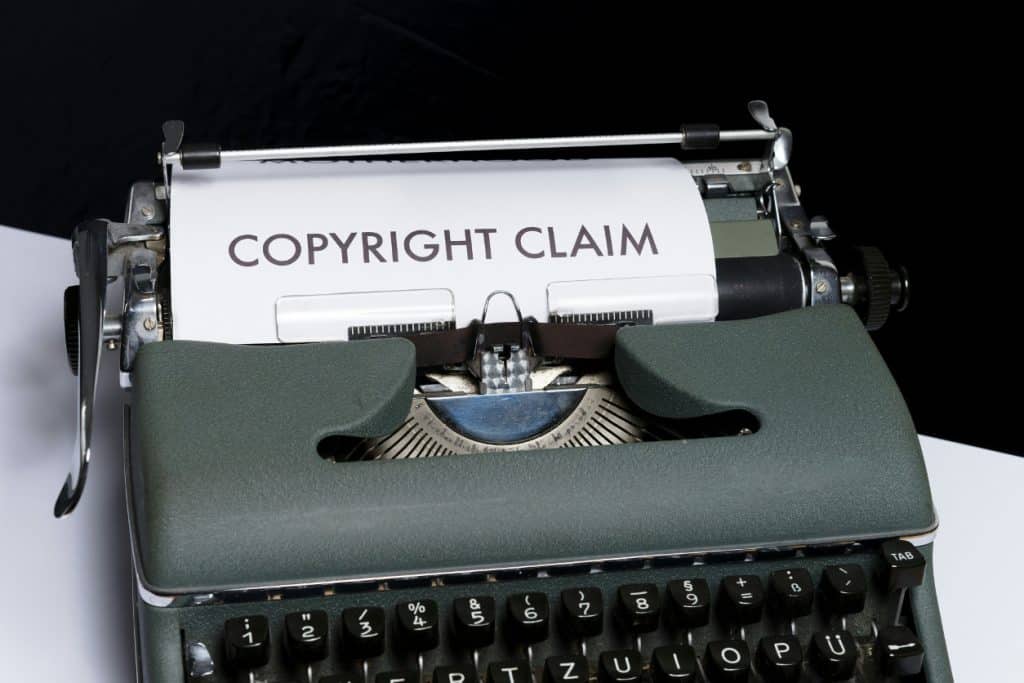 Old typewriter with paper that reads copyright claim intellectual property in divorce