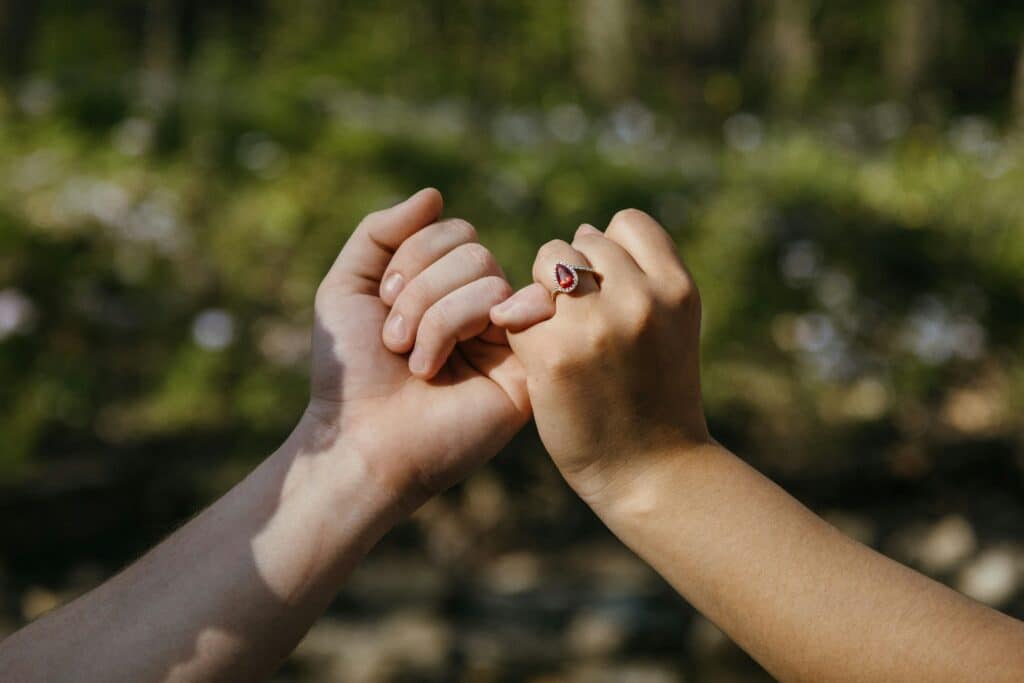 Pinky Promise, two hands one with ring